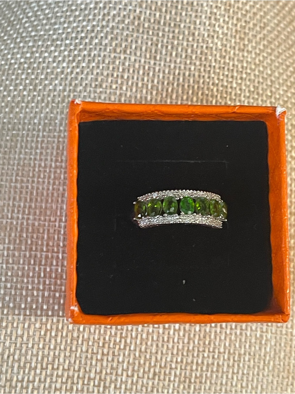 New 925 silver jewelry piece featuring a row of seven  vibrant green gemstones